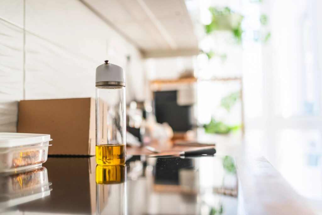 Extra virgin olive oil bottle on a clean, bright kitchen counter