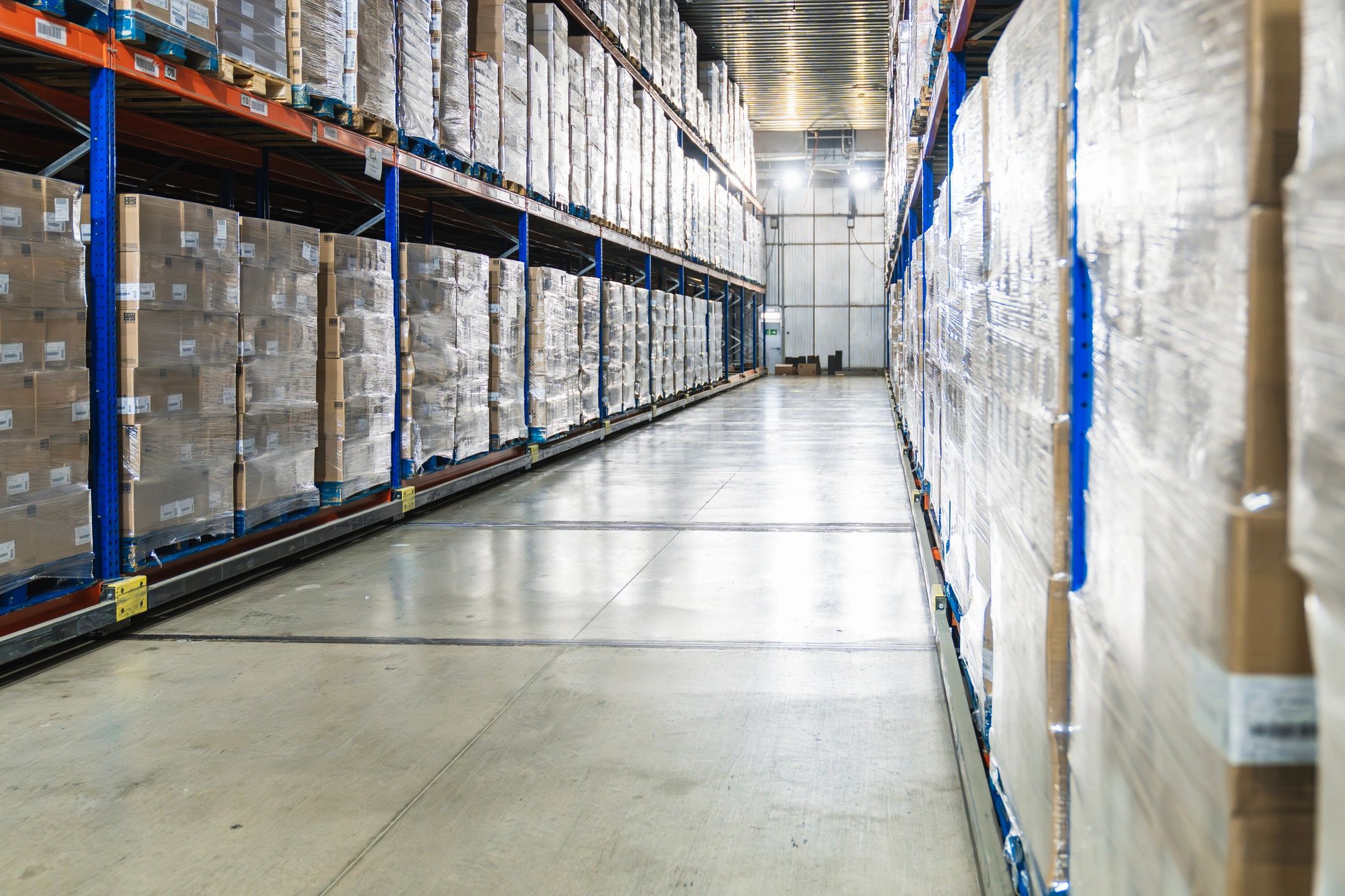 Cold storage warehouse aisle with pallets and boxes